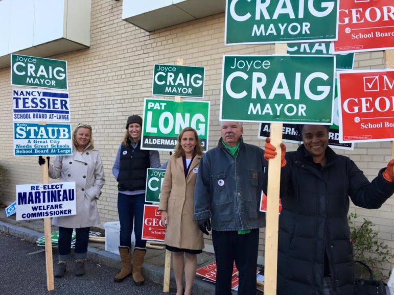 Joyce Craig, center, campaigning on Election Day at the polls.