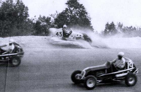 A rare Midget action-shot from New Hampshire’s former Manchester Motordrome. Pictured: Art Rousseau #19, Bob Boone #3 and Pat Thibault #12.