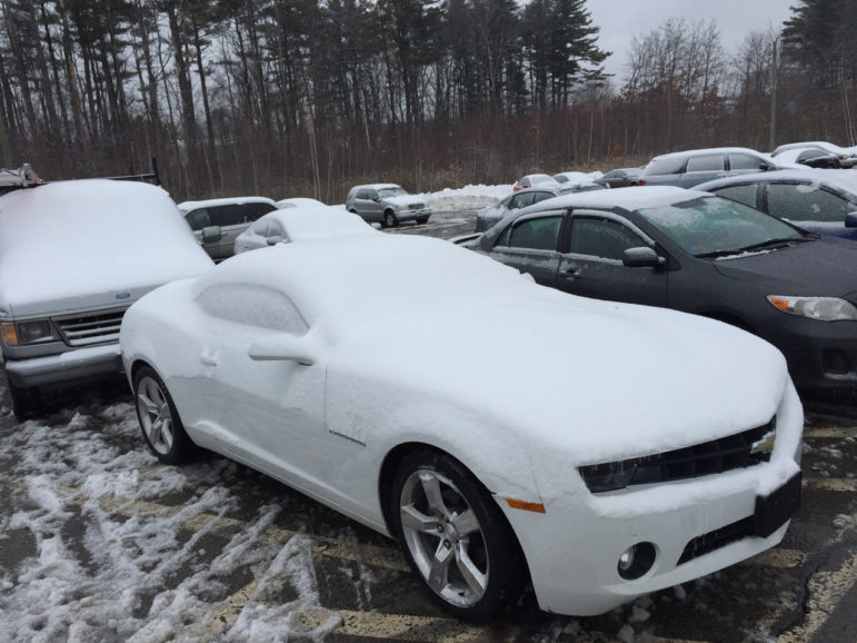 James Hardy, helping his brother Dan get his car back, noted that the owner of this white Camaro with 20-day plates was probably going to be upset. "You never know. Anything can happen to your car when it's towed."