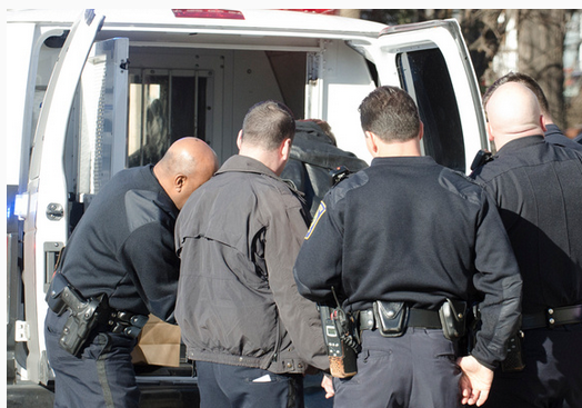 Flint Swett is taken into custody by Manchester Police.