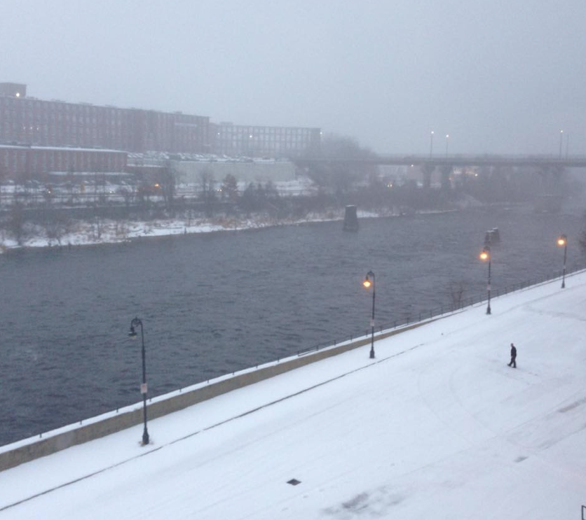 Snowy haze over the Merrimack River at the Manchester Millyard Tuesday morning.