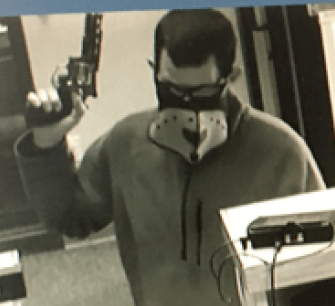 Surveillance photo of Nov. 7 Triangle Credit Union robber. Gerard Dionne was arrested Saturday in connection to that robbery.