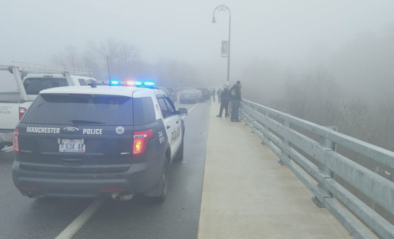 Scene on Biron Bridge Friday morning after a man apparently jumped from the bridge onto Electric Street below.