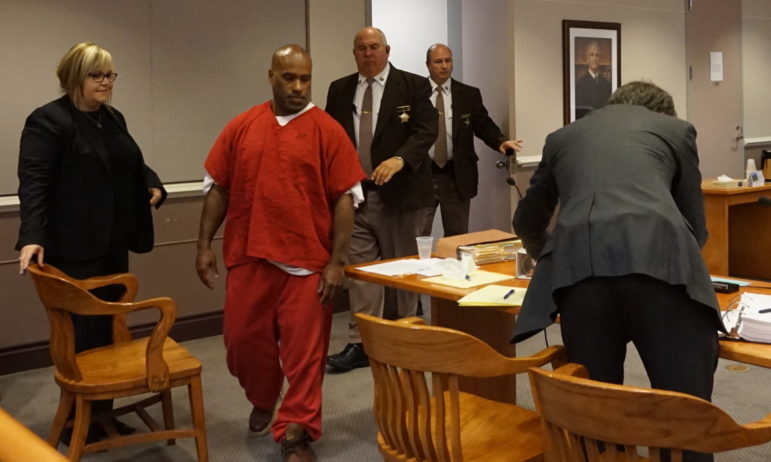 Eduardo Lopez Jr., center, is pictured with his attorneys Pamela Jones, left, and Paul Borchardt, right, at a hearing in Hillsborough County Superior Court South in Nashua.