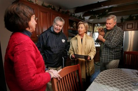Democratic presidential hopeful, Sen. Hillary Rodham Clinton, D-N.Y. second from right, talks with Patty and Rik Cornell, far right, while going door-to-door campaigning with supporter sate Sen. Lou D'Allesandro in Manchester, N.H., Saturday, Dec. 15, 2007. 