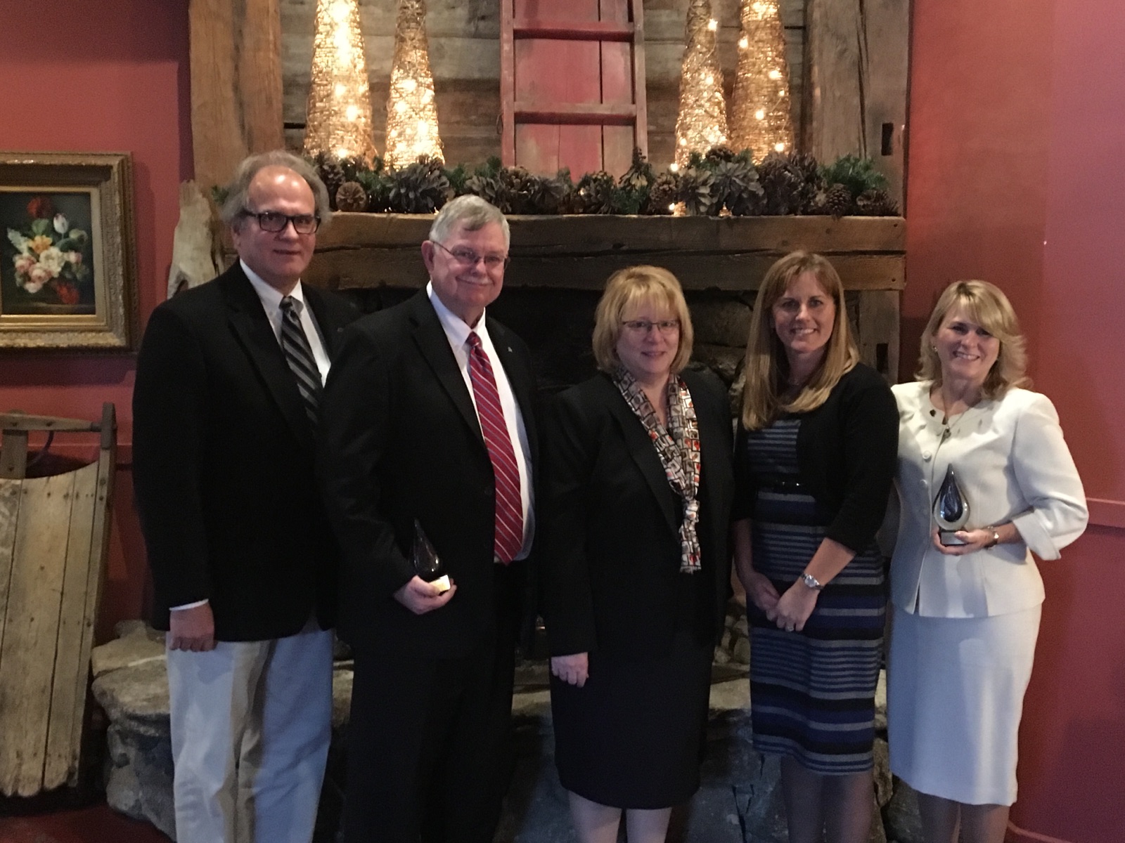 Memorial High School's Peter Perich (second from left), a finalist for NH Assistant Principal of the Year, and Karen Machado (far right), a finalist for NH Secondary School Principal of the Year picturede with last year's NH Secondary School Principal of the Year Arthur Adamakos (far left), superintendent Debra Livingston (center), and the 2016 NH Elementary School Principal of the Year Shelly Larochelle (second from right).