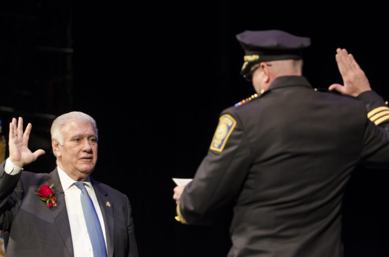 Mayor Ted Gatsas is sworn in as the 47th mayor of Manchester by Manchester Chief of Police Nick Willard.