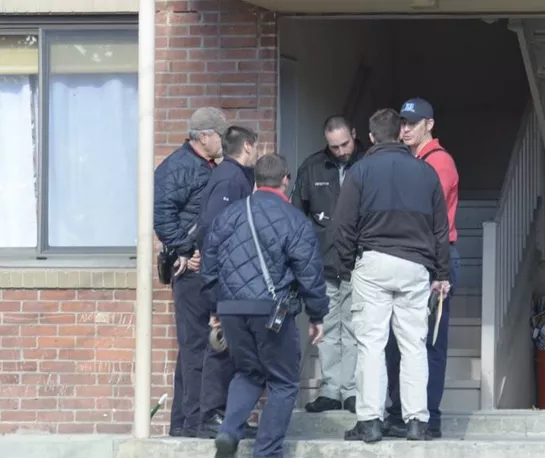 Detectives on the scene at Kimball Street residence in November 2015.