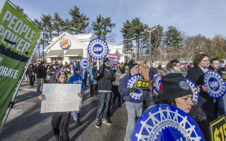 Protestors with support from SEIU members stopped traffic on South Willow Street Saturday in a protest for higher wages and the right to unionize.