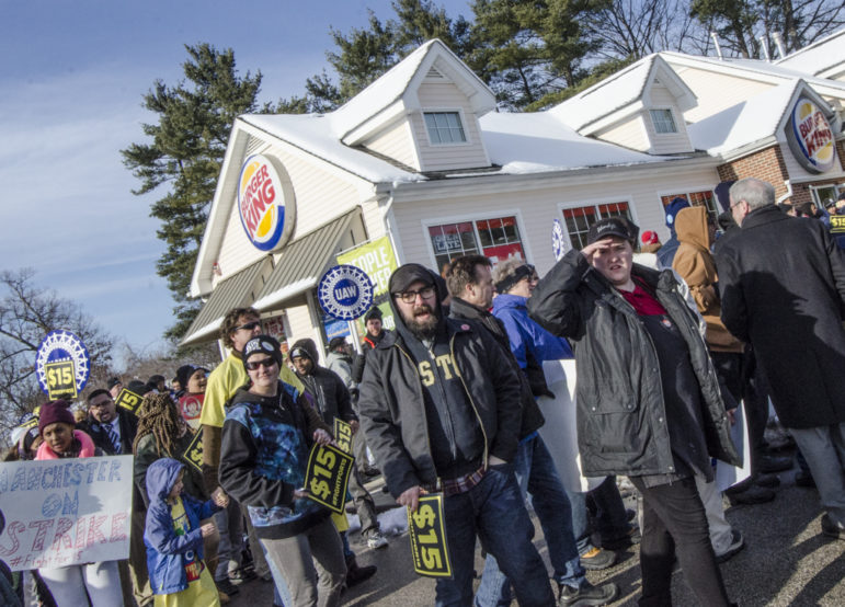 Protestors outside Burger King on South Willow Street as part of the Fight for $15 national movement.