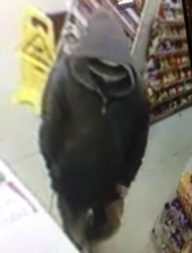 Suspect in armed robbery from store surveillance footage.