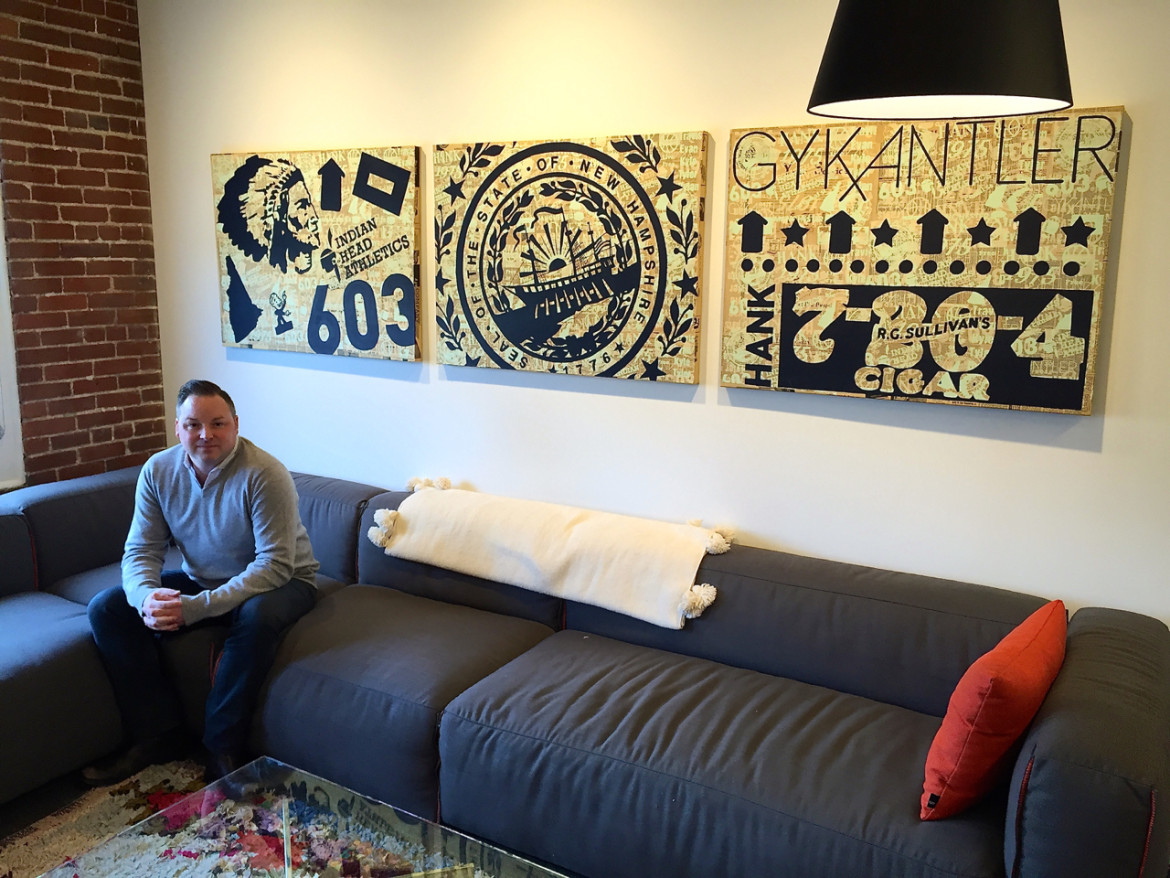 Travis York in his happy place: The space that once served as his grandfather's corner office. And on the wall hands a trio of silk-screen mural, bringing together the family's three-generations of Manchester businesses.