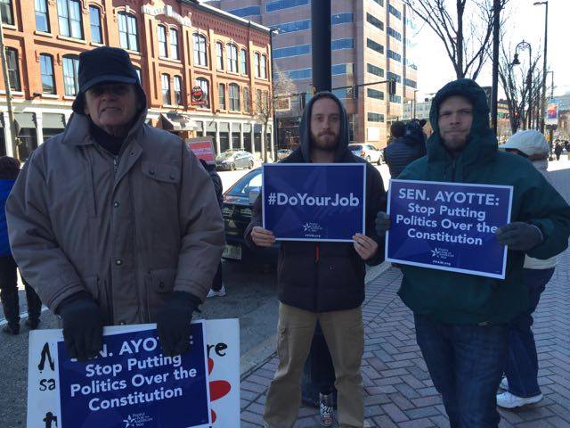 Protestors gathered outside U.S. Sen. Kelly Ayotte's Manchester office on March 3 urging her to "do her job" and not obstruct the Supreme Court selection process.