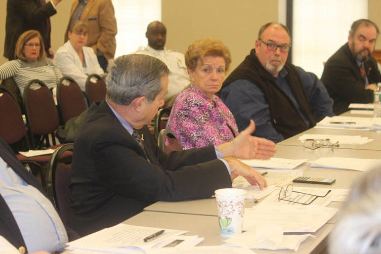 State Rep. Neal Kurk, R-Weare, left, speaks as County Commissioner Sandra Ziehm, center, and Hillsborough County Prison Superintendent David Dionne, right, listen. during a March 4 presentation on a proposed drug treatment program.