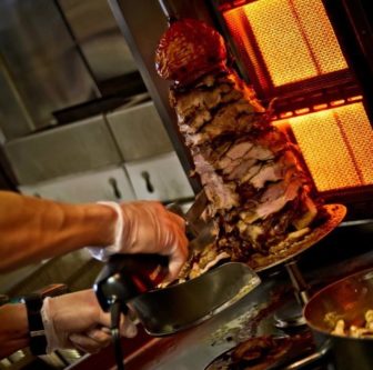 Pork on a rotisserie for gyro at The Gyro Spot