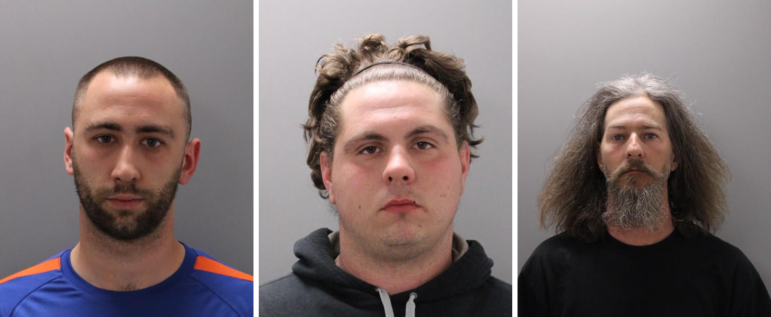 Left to right: Jeffrey Riley, Anthony Perkins-Brainard and Kevin Hardy, three of the eight people arrested for felony riot Friday in Bedford. 