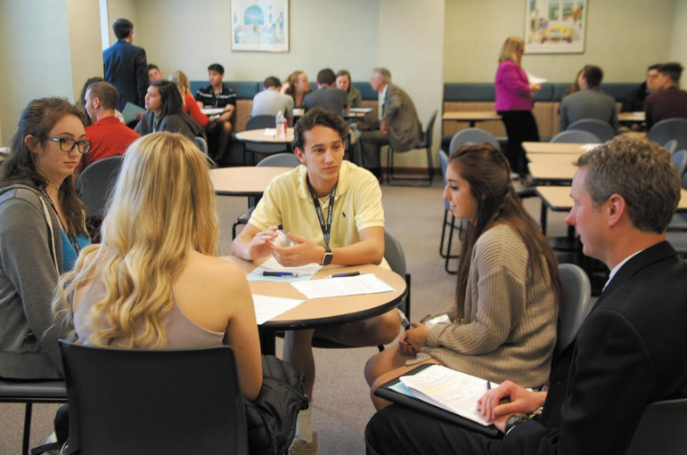 Attorney Steven Dutton, right, with a group of Central High School students, participating in the new Street Law program at McLane Middleton.
