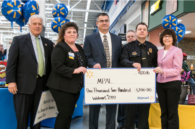 One of many "super" sized checks presented to community groups during Wal-mart's grand opening.