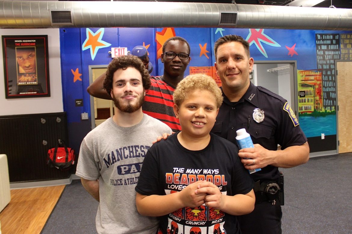 From left: Michael Correa, Majak Kon, Joskar "Rainbow" Bautista and Officer John Lavasseur.