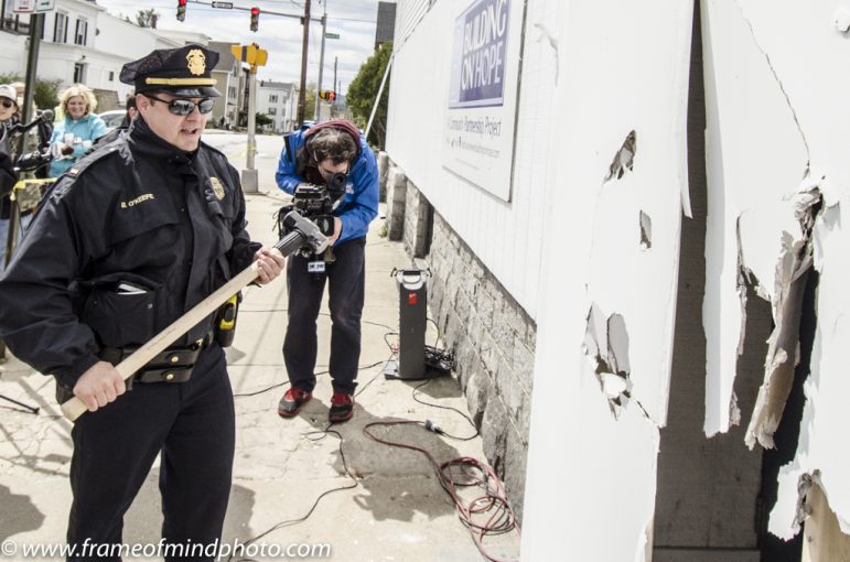 Lt. Brian O'Keefe taekes a turn with the sledgehammer.