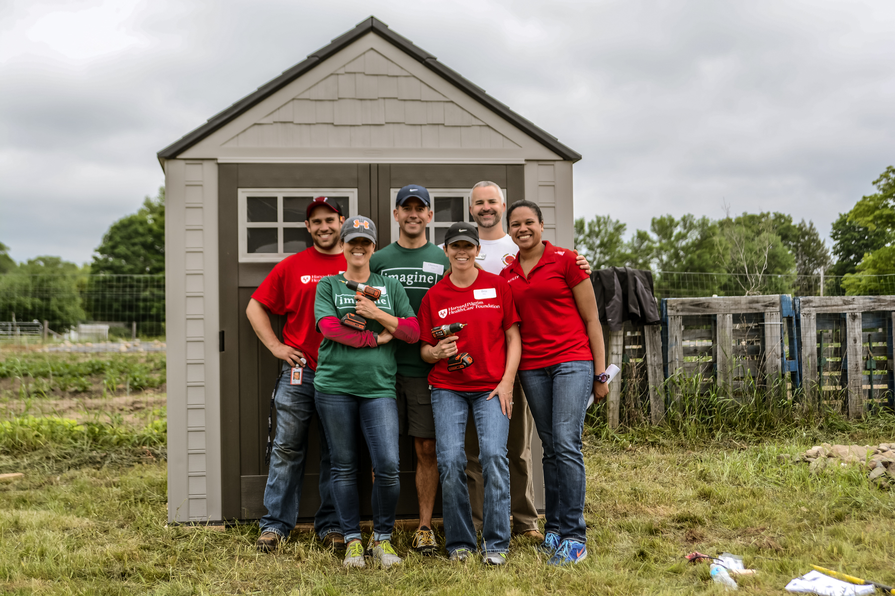 More than 100 volunteers from Harvard Pilgrim Health Care, Dartmouth Hitchcock, and Eastern Bank participated in a Day of Service building a garden shed and weeding and gardening in the NH Food Bank’s Production Garden on North River Road in Manchester. 