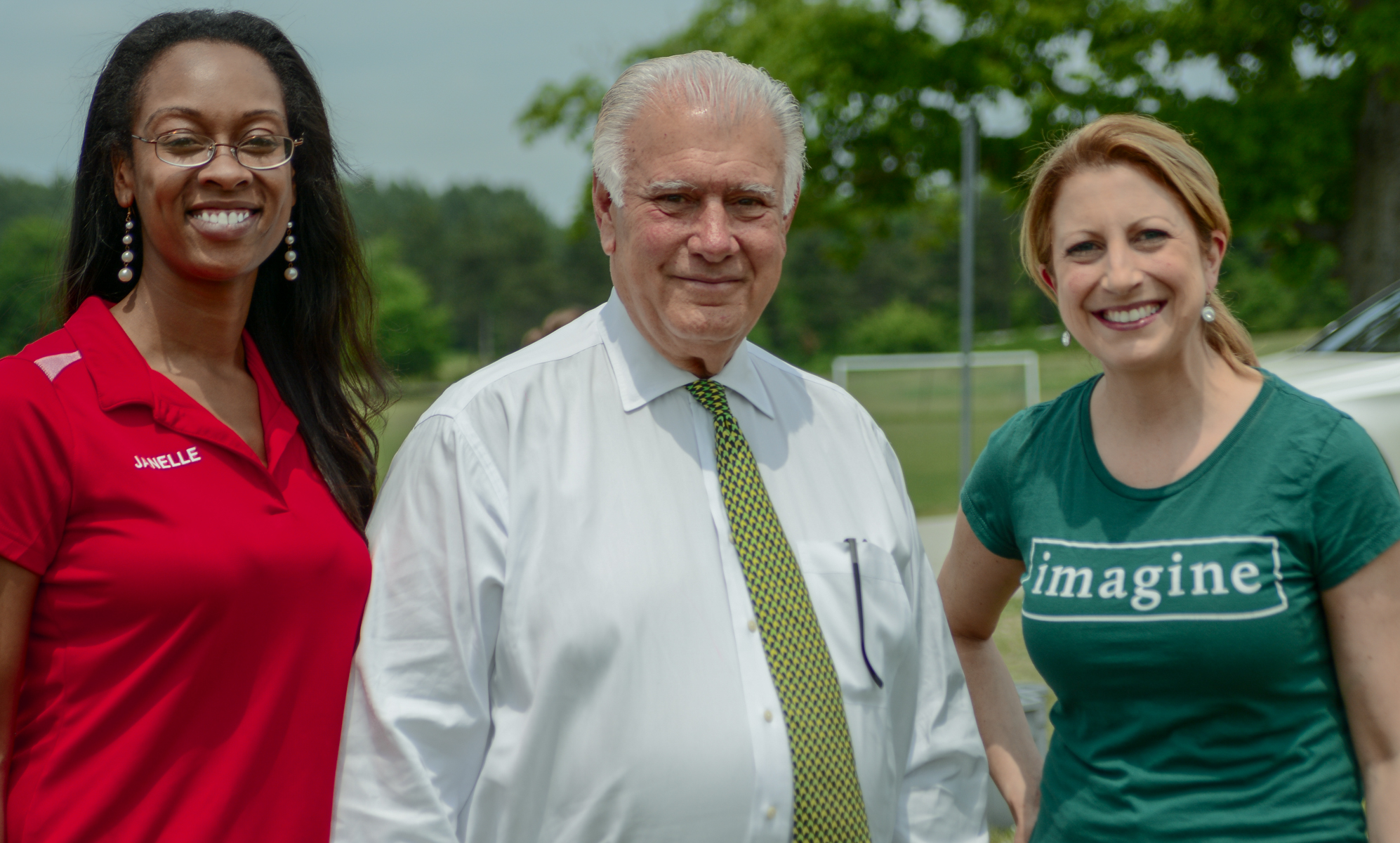 Janelle Woods-McNish, Director of Giving and Service for Harvard Pilgrim Health Care Foundation (left), is joined by Mayor Ted Gatsas and Melissa Skarupa, Community Relations Manager for Dartmouth-Hitchcock, at today’s 8th annual Day of Service in Manchester. More than 100 volunteers weeded and planted in the NH Food Bank’s Production Garden on North River Road in Manchester.