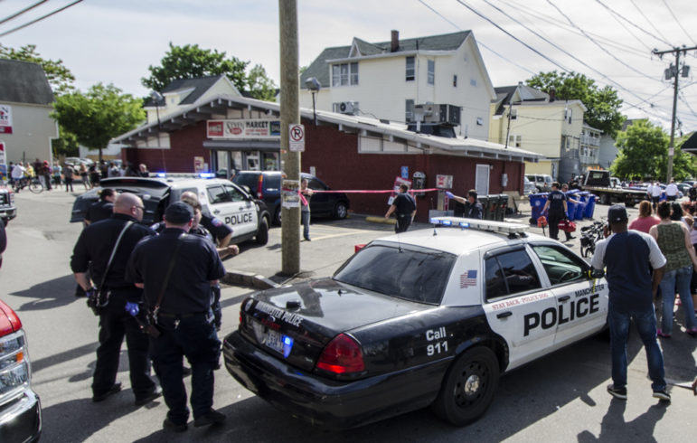 Crime scene taped off after fatal shooting Wednesday outside of Seven Days Market.