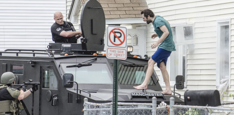 A man who was barricaded inside a residence on Krakow Avenue exited through a window and onto the hood of the SWAT vehicle after tear gas was used.