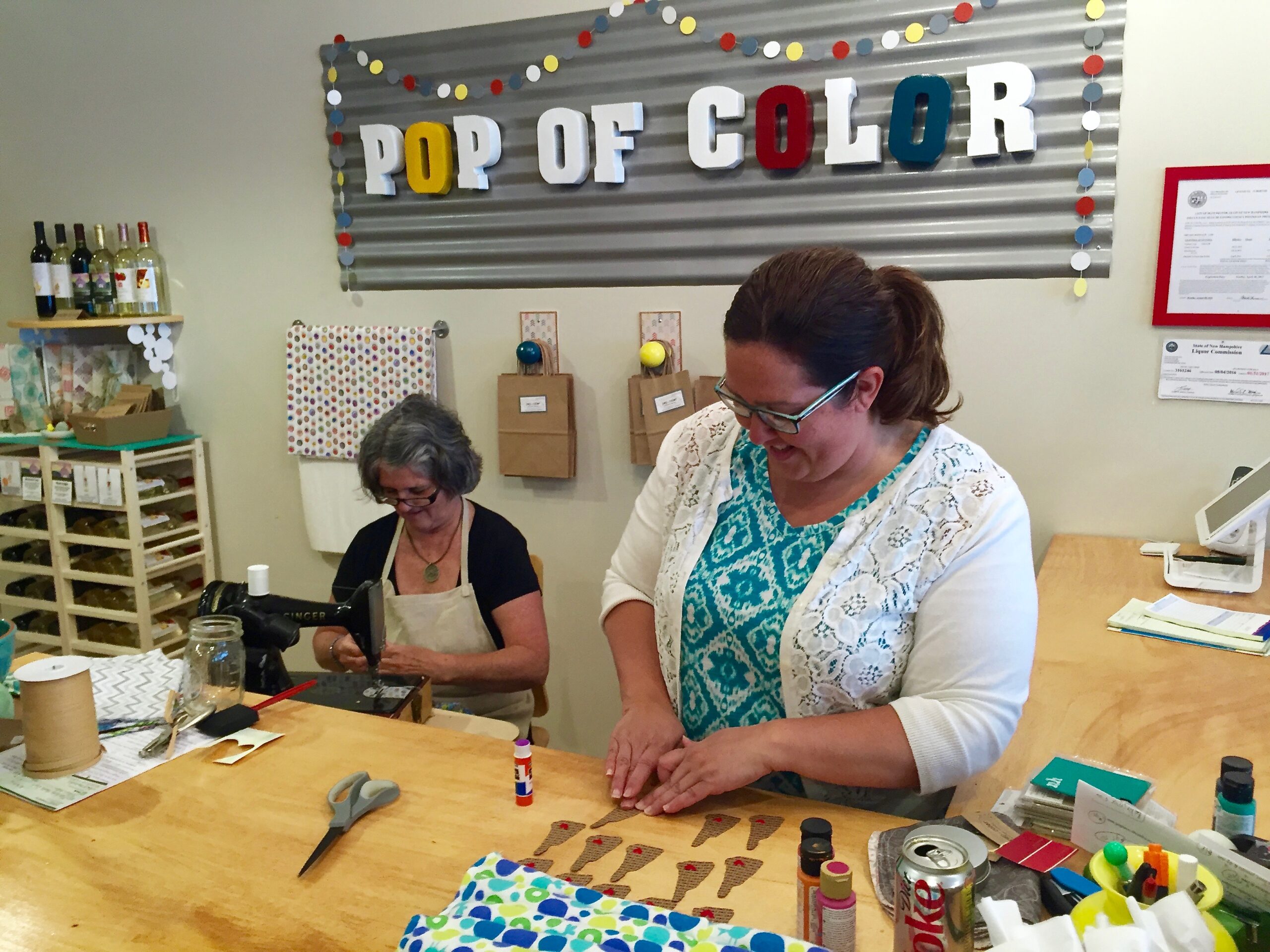 Chelsea Stoddard, left, owner of Pop of Color, with her mom, ... 