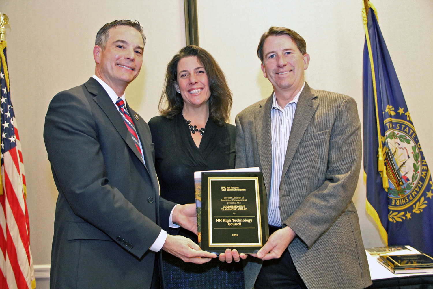 Department of Resources and Economic Development Commissioner Jeffrey Rose presented his annual Teamwork award to Micheline Dufour and Matt Cookson of the NH High Technology Council in Manchester.