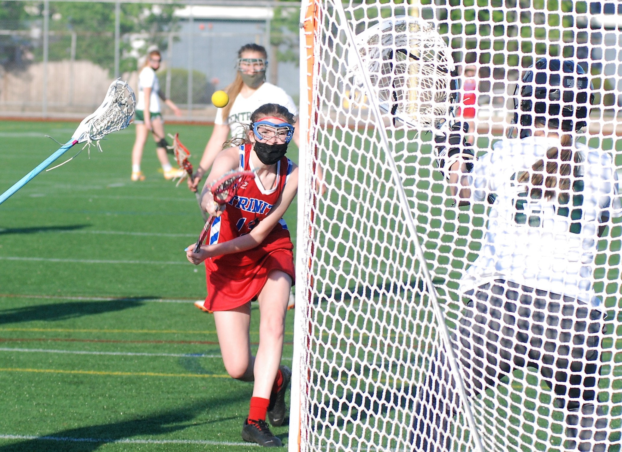 Carolyn Burleigh fires a hard shot on net.