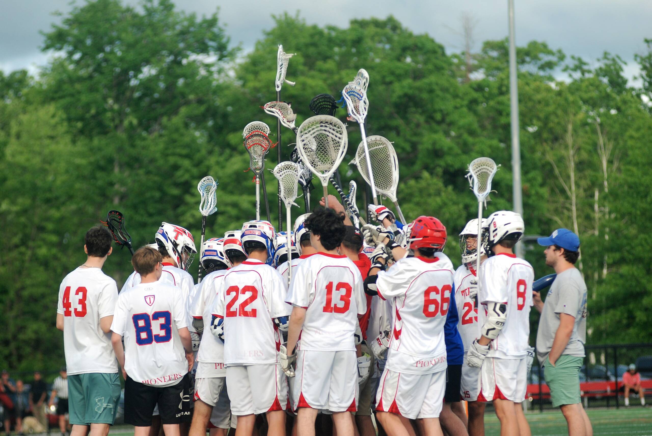 Trinity players hudlled following a playoff win.