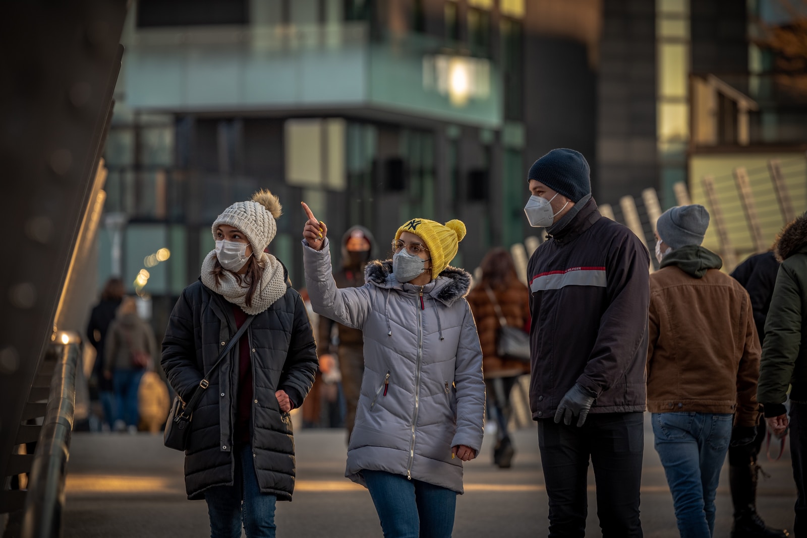man in brown jacket standing beside woman in brown coat