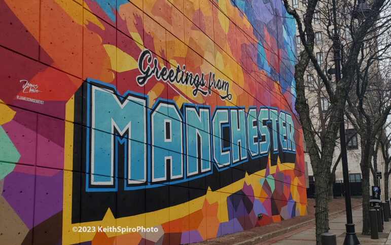 photo of mural "greetings from Manchester" 