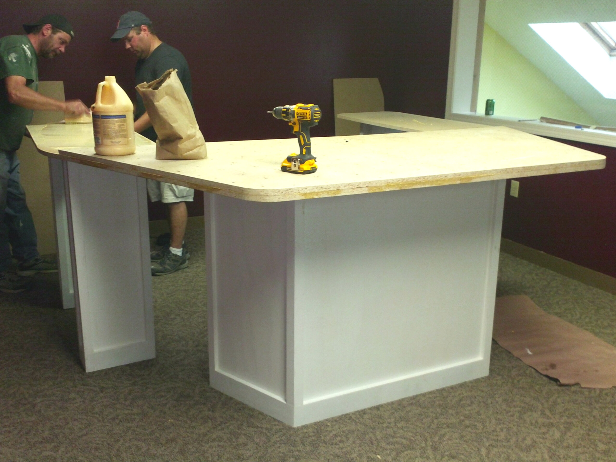  Jeff Brockstead and Bill Oxley work on the new eight-person interview table as part of the major expansion for WLMW and the Girard at Large show.  