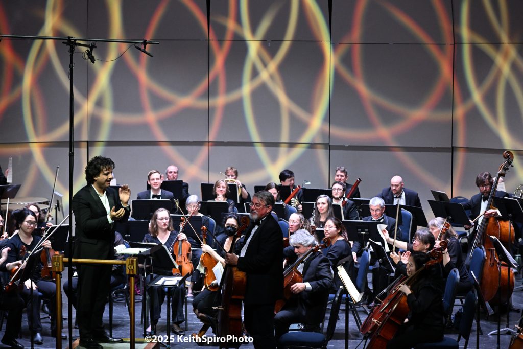 Image of principal Cellist Nathaniel Lathrop being recognized at conclusion of the concert. A photo by Keith Spiro