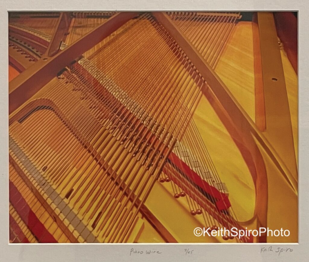 photo by Keith Spiro of inner workings of a piano capture the interest of jazz fans. 