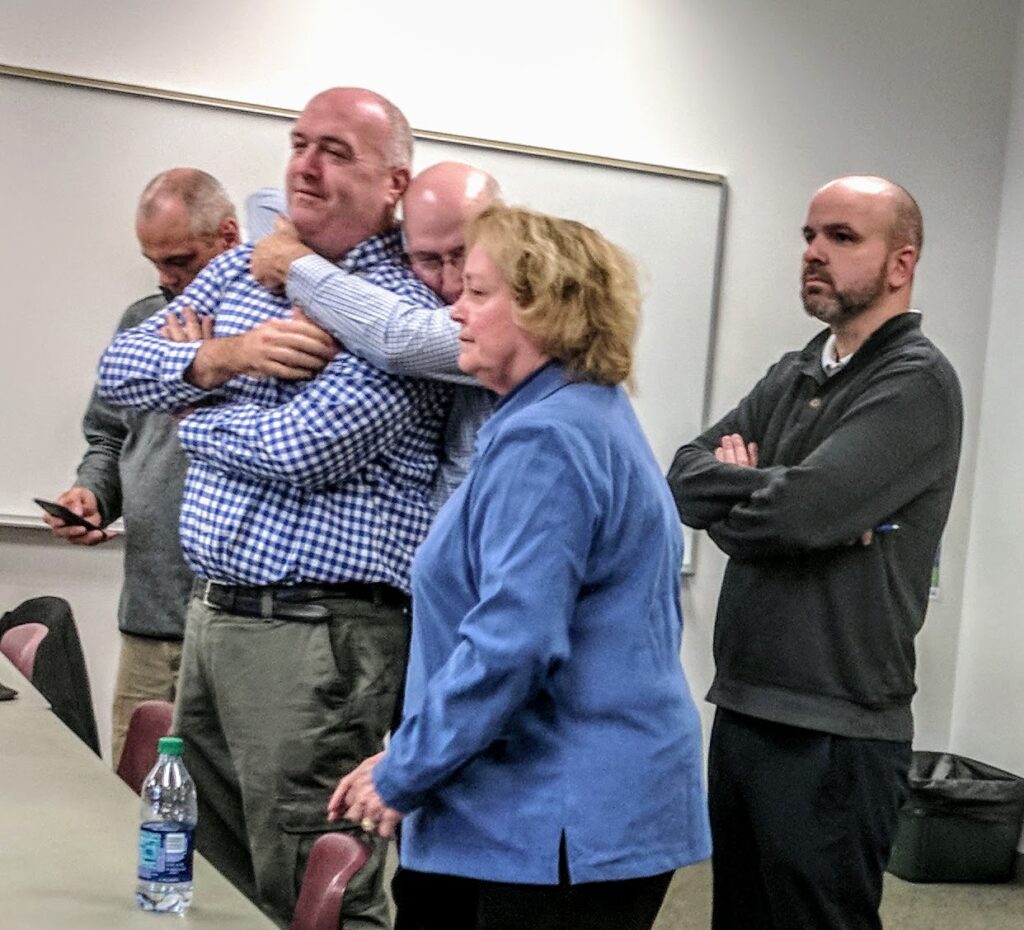 Maureen Baines, center, with Bob Baines giving son Tim Baines a bear hug after winning a recount during his race for Ward 3 Alderman in 2017.