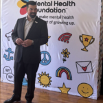 Coach Ryan Day returns to Manchester speaking on mental health issues facing kids today