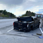 Mass. driver charged following crash after state police say he tossed firearm from truck